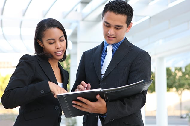 Young professionals reviewing materials