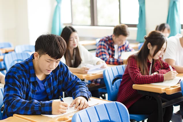 A group of students taking the TOEFL exam