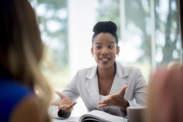 An employer speaks to a job applicant