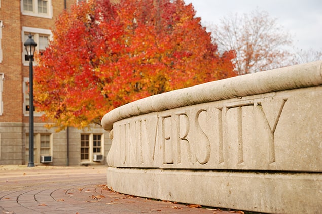 University sign in autumn