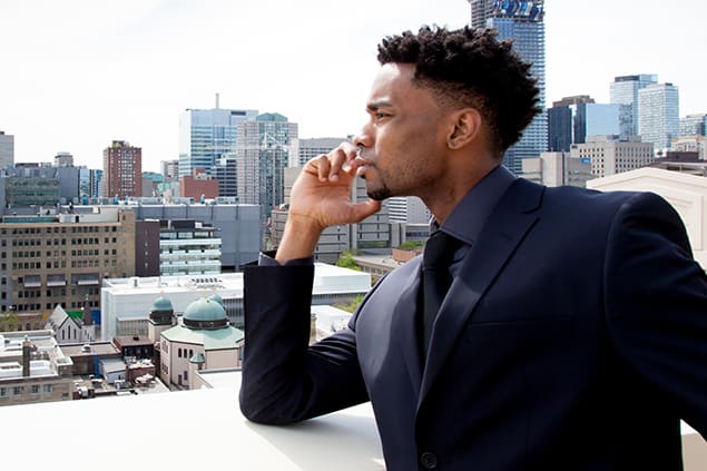 Businessman in front of the Toronto cityscape