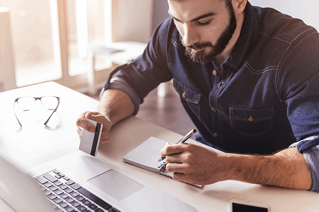 Man making an online purchase with a credit card.